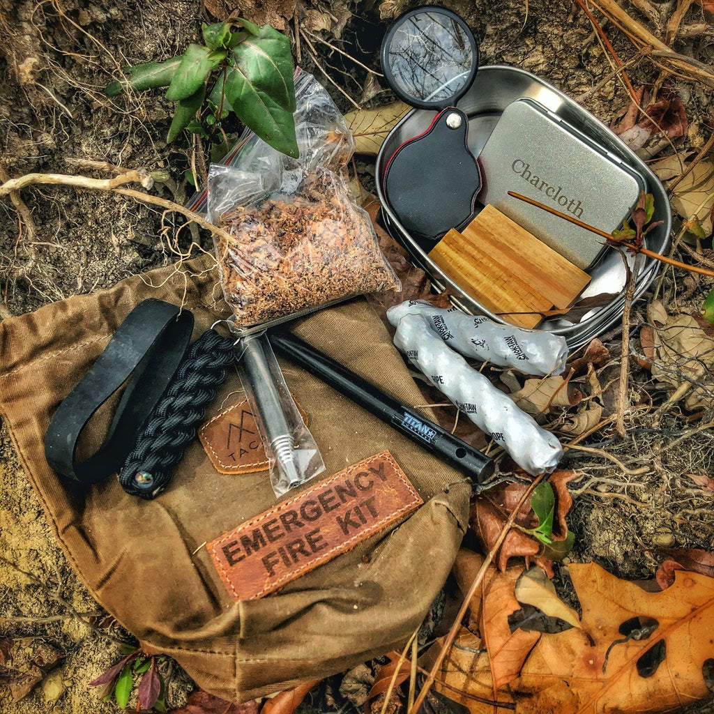 Emergency fire kit with tools and supplies on a natural background