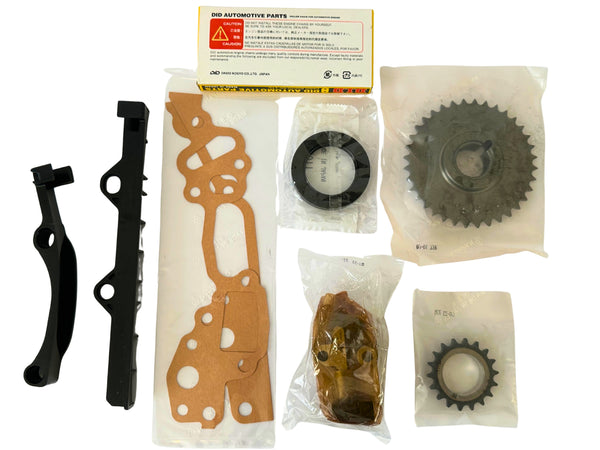 Collection of automotive parts including gears and gaskets on a white background