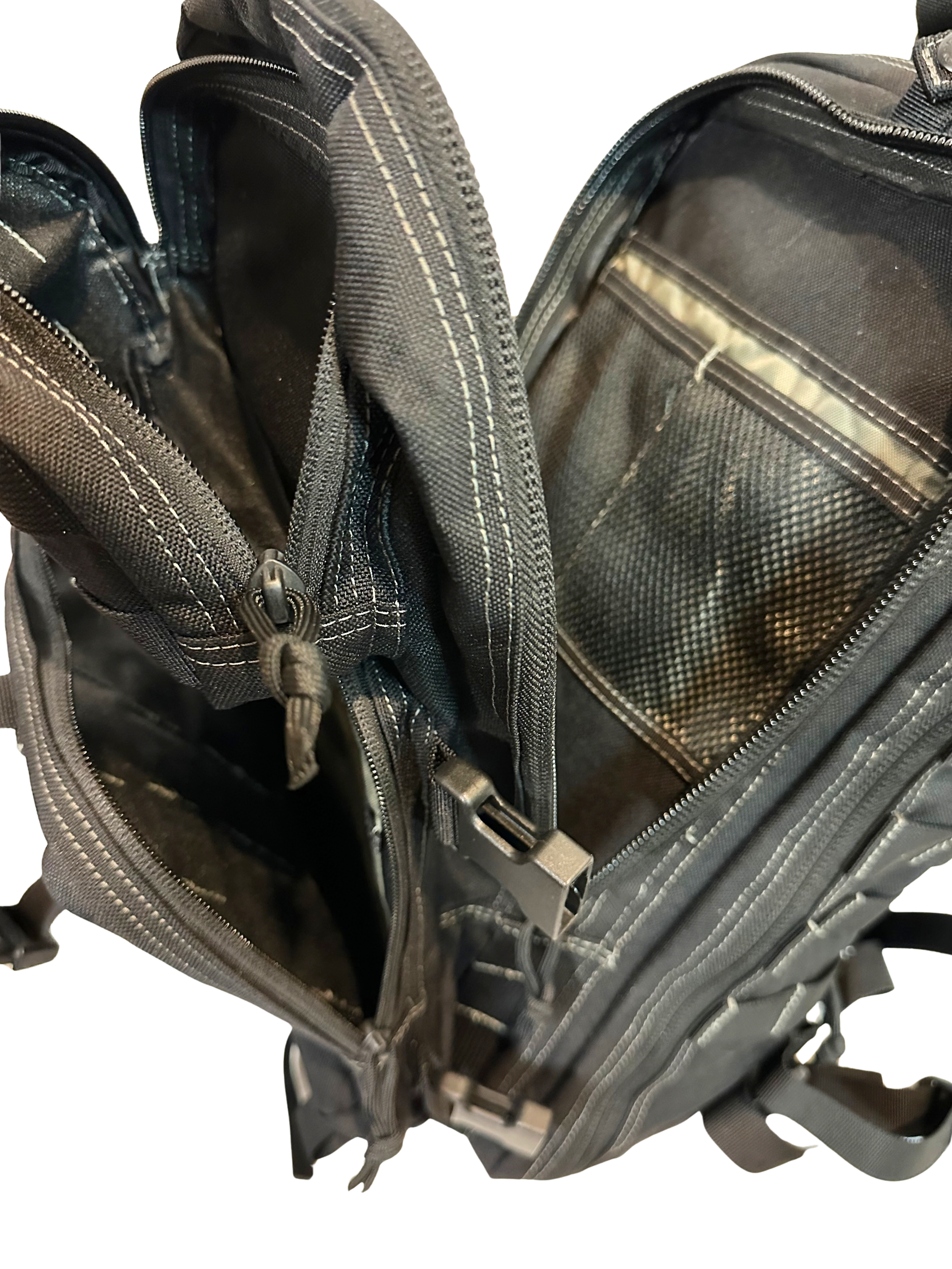 Open black backpack with compartments on a white background