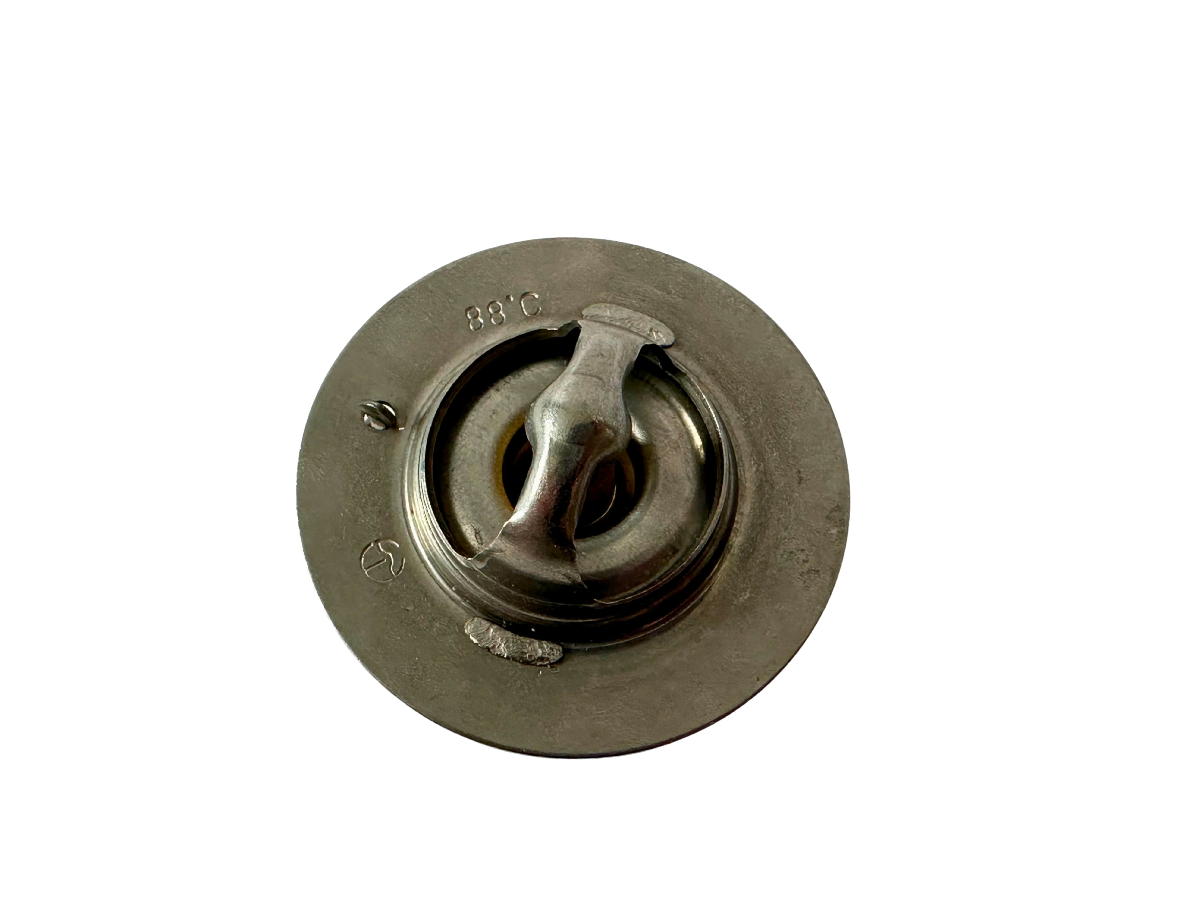 Metallic cooling thermostat on a white background