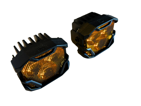 To Amber colored LED pods with black metal frame on a white background