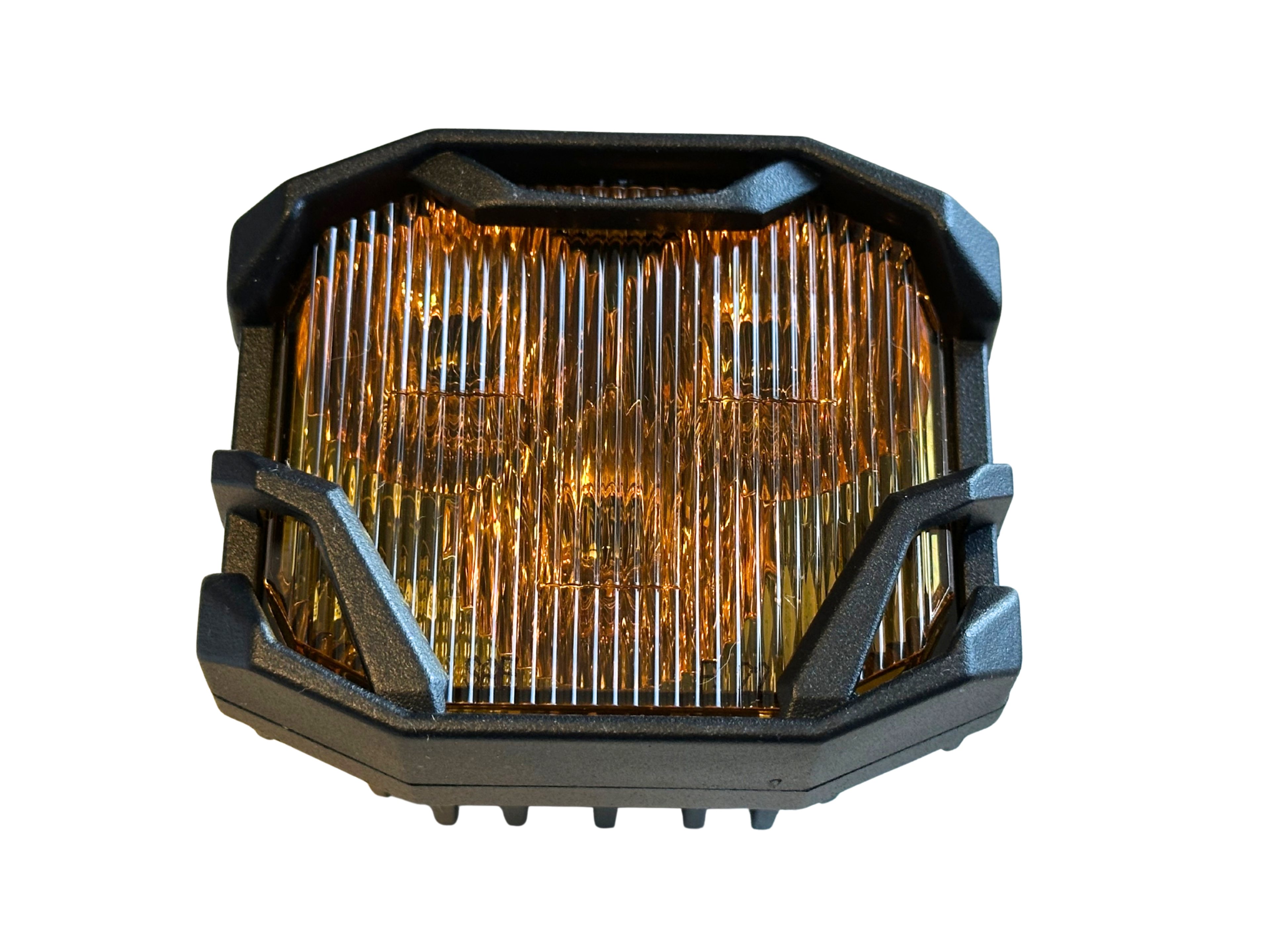Amber colored LED pod lens close-up on a white background showing the wide lens