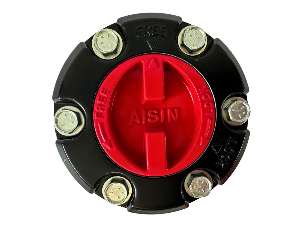 Round mechanical component with red center and black outer shell, featuring the Aisin logo.